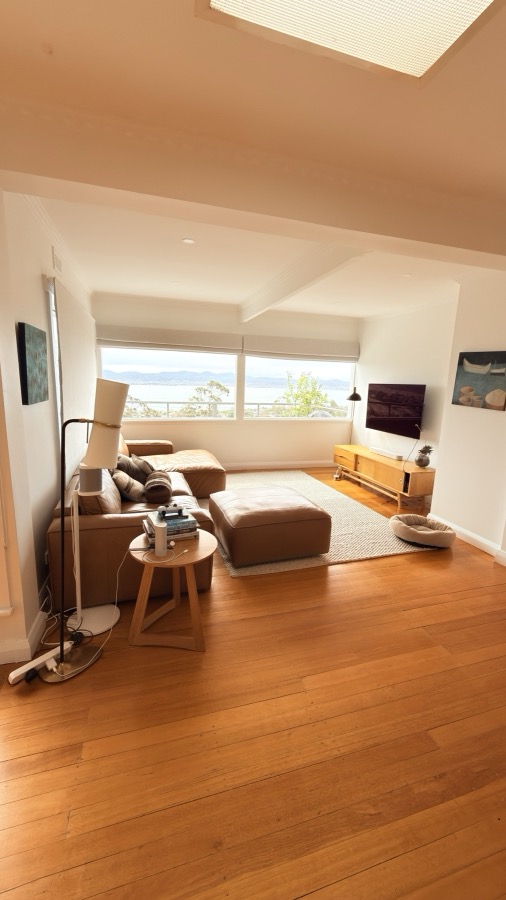 Living room with ocean view after a FYS Cleaning Services clean, Brisbane home